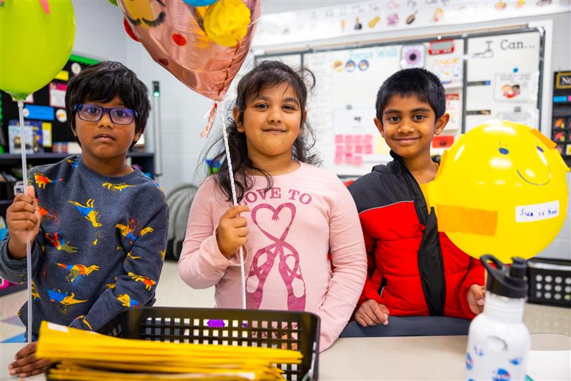 Students participate in a balloon parade